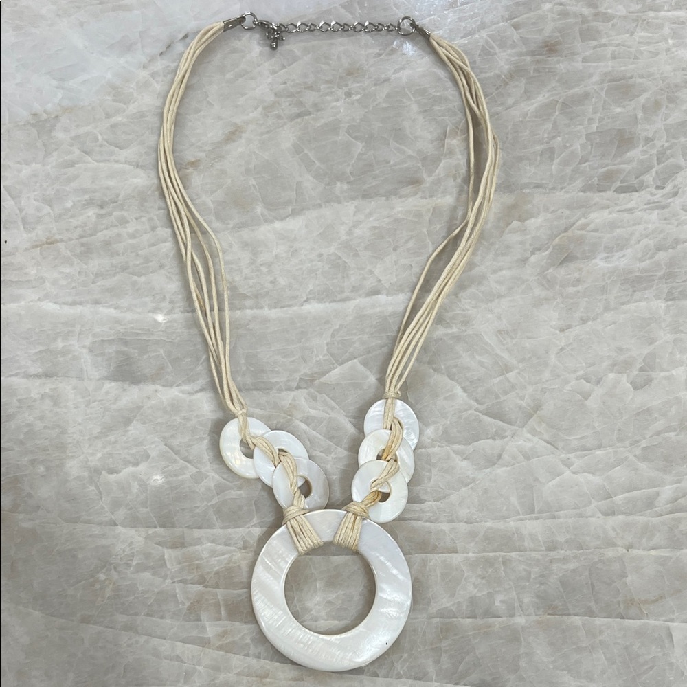 Mother Of Pearl Discs On White Multi Strand Cords